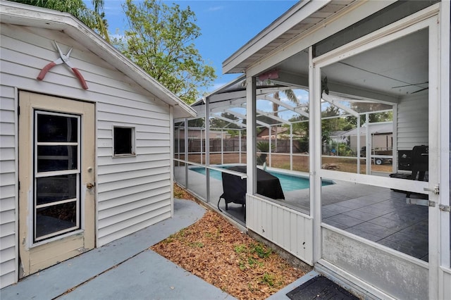 view of patio with a lanai and fence