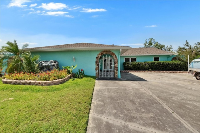 6530 Manila Palm Way, Apollo Beach, FL 33572 - single story home featuring a front lawn and stucco siding