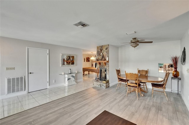 6530 Manila Palm Way, Apollo Beach, FL 33572 - dining area with wood finished floors, a fireplace, ceiling fan, and baseboards