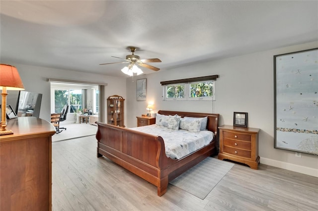 6530 Manila Palm Way, Apollo Beach, FL 33572 - bedroom featuring light wood finished floors, access to exterior, a ceiling fan, and baseboards