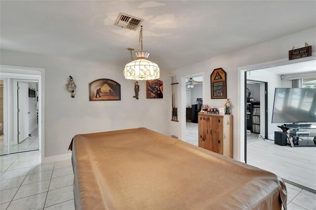 6530 Manila Palm Way, Apollo Beach, FL 33572 - game room with light tile patterned floors, ceiling fan, and baseboards