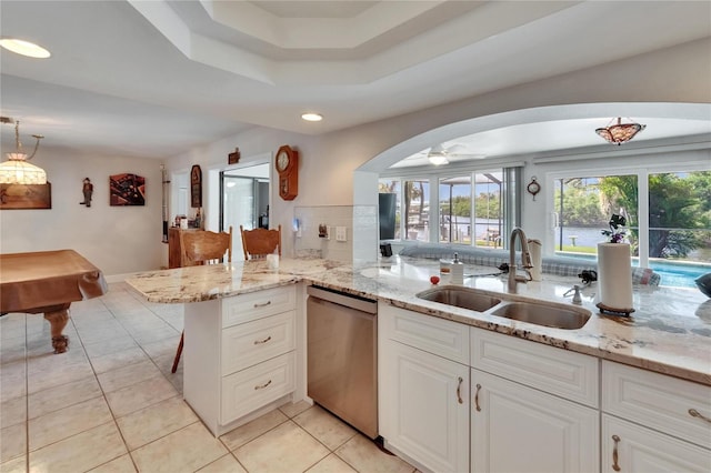 6530 Manila Palm Way, Apollo Beach, FL 33572 - kitchen with dishwasher, a sink, light tile patterned floors, arched walkways, and recessed lighting