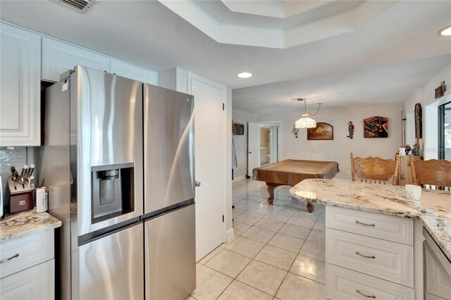 6530 Manila Palm Way, Apollo Beach, FL 33572 - kitchen featuring stainless steel fridge, light tile patterned flooring, billiards, white cabinets, and light stone countertops