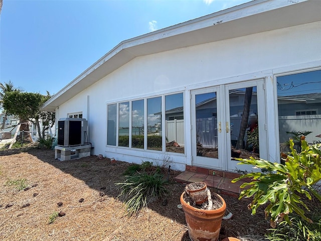 719 59th Ave, St Pete Beach, FL 33706 - back of house with cooling unit