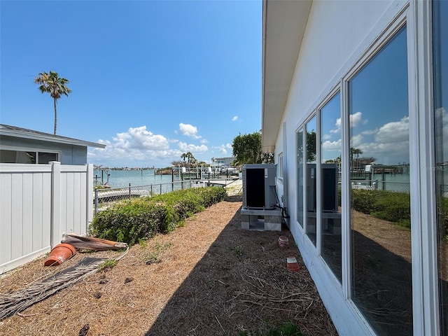 719 59th Ave, St Pete Beach, FL 33706 - view of yard with fence and a water view