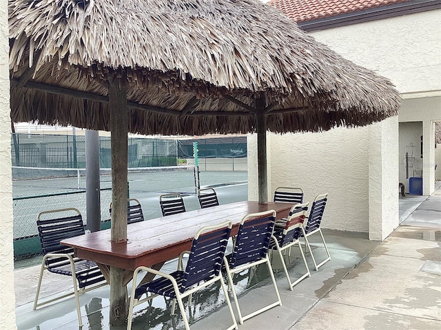 120 1st St E Unit 104, Saint Petersburg, FL 33715 - view of patio featuring a gazebo and outdoor dining area
