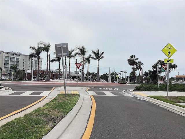 120 1st St E Unit 104, Saint Petersburg, FL 33715 - view of asphalt street with traffic signs, curbs, and sidewalks