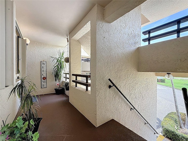 120 1st St E Unit 104, Saint Petersburg, FL 33715 - corridor featuring a textured wall and healthy amount of natural light