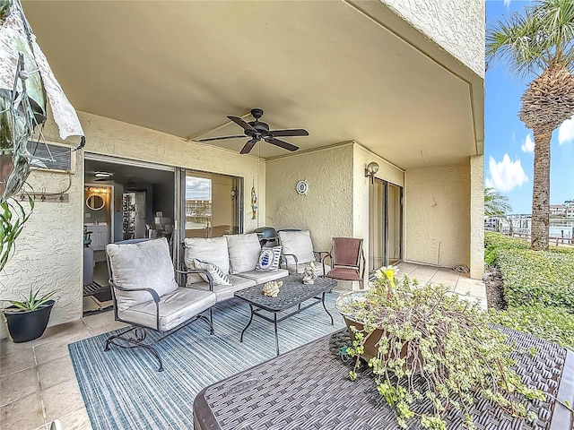 120 1st St E Unit 104, Saint Petersburg, FL 33715 - view of patio with a ceiling fan and an outdoor living space
