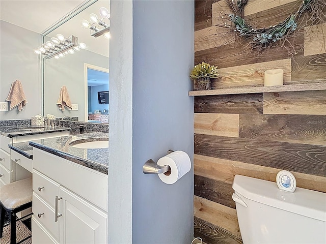 120 1st St E Unit 104, Saint Petersburg, FL 33715 - bathroom with vanity and wooden walls