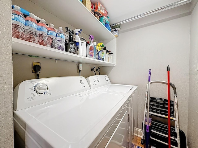 120 1st St E Unit 104, Saint Petersburg, FL 33715 - washroom with washer and dryer and a textured wall