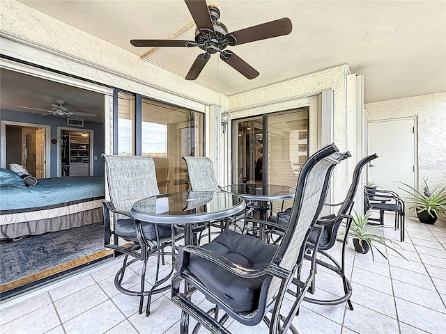 120 1st St E Unit 104, Saint Petersburg, FL 33715 - view of patio featuring a ceiling fan and outdoor dining area