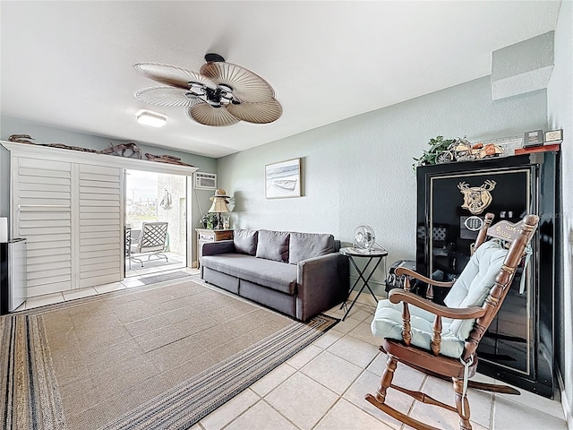 120 1st St E Unit 104, Saint Petersburg, FL 33715 - living area featuring ceiling fan, light tile patterned floors, a textured wall, and a wall mounted AC
