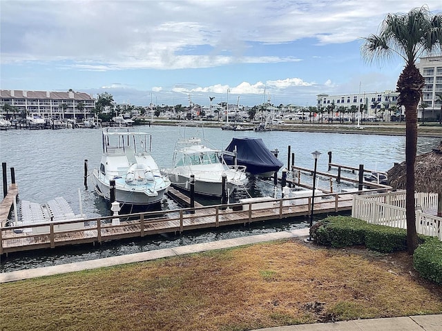 120 1st St E Unit 104, Saint Petersburg, FL 33715 - dock featuring a water view and boat lift