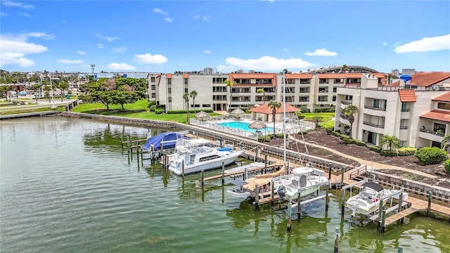 120 1st St E Unit 104, Saint Petersburg, FL 33715 - dock featuring boat lift and a water view