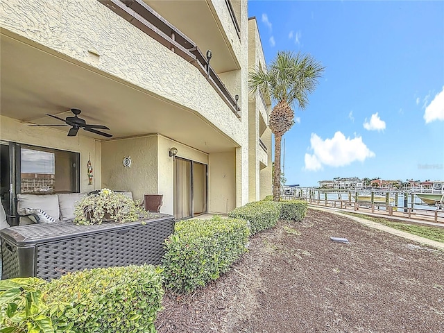 120 1st St E Unit 104, Saint Petersburg, FL 33715 - view of side of property featuring a ceiling fan and stucco siding