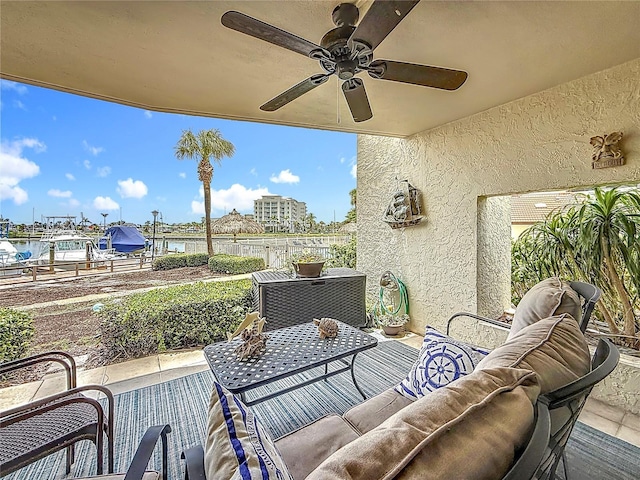 120 1st St E Unit 104, Saint Petersburg, FL 33715 - view of patio / terrace featuring outdoor lounge area, a ceiling fan, and a water view