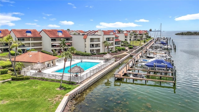 120 1st St E Unit 104, Saint Petersburg, FL 33715 - dock featuring boat lift, a water view, and a residential view