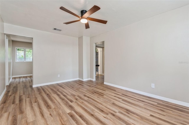 1727 Bonita Ave, Orlando, FL 32805 - spare room with light wood-style flooring, a ceiling fan, and baseboards