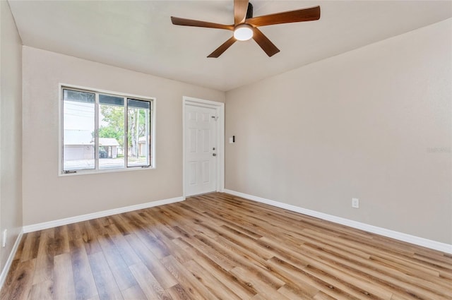 1727 Bonita Ave, Orlando, FL 32805 - empty room featuring light wood-style floors, baseboards, and a ceiling fan