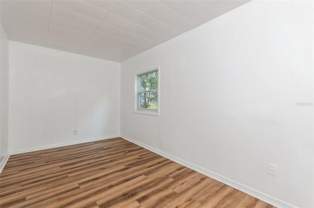1727 Bonita Ave, Orlando, FL 32805 - empty room featuring wood finished floors and baseboards