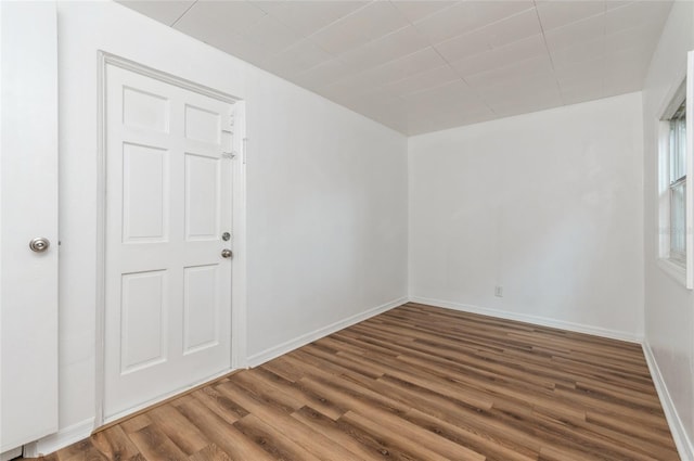 1727 Bonita Ave, Orlando, FL 32805 - spare room with wood finished floors and baseboards