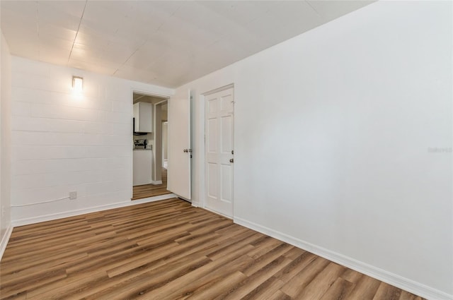 1727 Bonita Ave, Orlando, FL 32805 - spare room featuring wood finished floors and baseboards