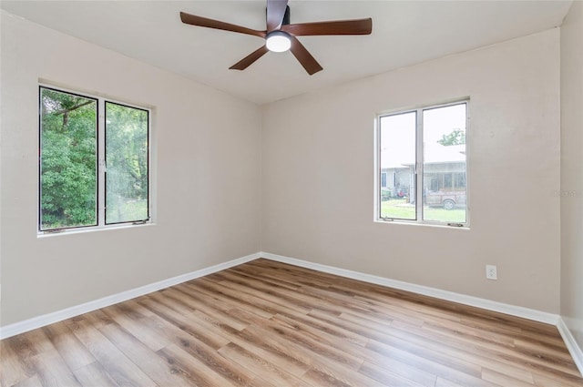 1727 Bonita Ave, Orlando, FL 32805 - spare room featuring light wood-type flooring, baseboards, and a ceiling fan