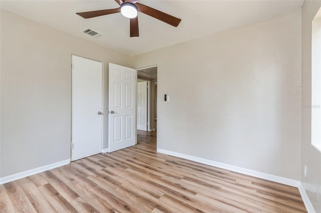 1727 Bonita Ave, Orlando, FL 32805 - unfurnished bedroom with light wood-type flooring, baseboards, and ceiling fan