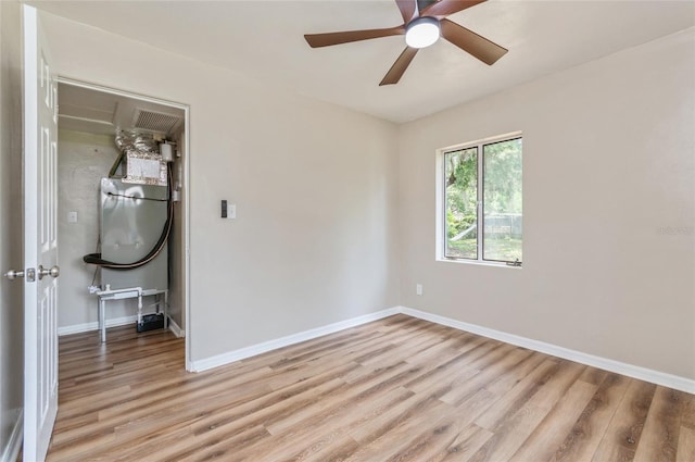 1727 Bonita Ave, Orlando, FL 32805 - unfurnished room featuring light wood-type flooring, baseboards, and ceiling fan