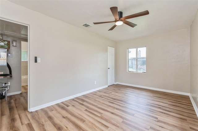 1727 Bonita Ave, Orlando, FL 32805 - unfurnished room featuring ceiling fan, light wood-style floors, and baseboards