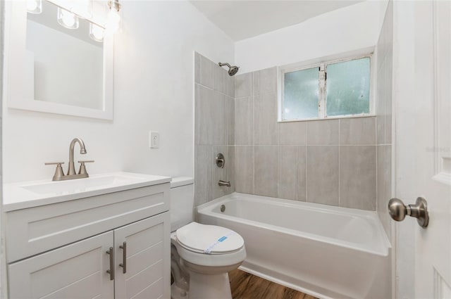 1727 Bonita Ave, Orlando, FL 32805 - full bathroom with toilet, vanity, shower / washtub combination, and wood finished floors