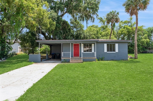 1727 Bonita Ave, Orlando, FL 32805 - view of front of home with concrete driveway, a front yard, a porch, and a carport