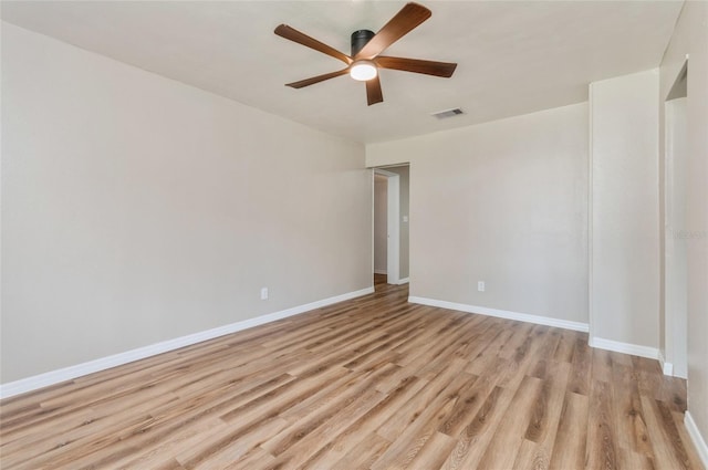 1727 Bonita Ave, Orlando, FL 32805 - spare room with a ceiling fan, light wood finished floors, and baseboards