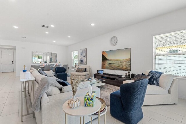 921 Fieldstone Way, Haines City, FL 33844 - living room with recessed lighting and light tile patterned floors