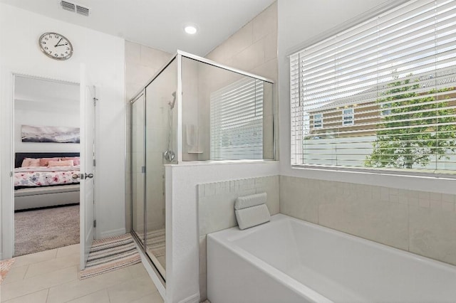 921 Fieldstone Way, Haines City, FL 33844 - ensuite bathroom with a stall shower, a garden tub, tile patterned flooring, and recessed lighting