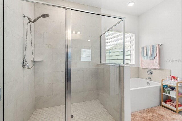 921 Fieldstone Way, Haines City, FL 33844 - full bathroom featuring a shower stall and a garden tub
