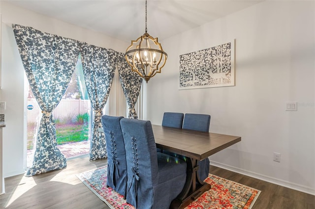 4316 Sailplane Ct, Wesley Chapel, FL 33545 - dining area with a chandelier, wood finished floors, and baseboards