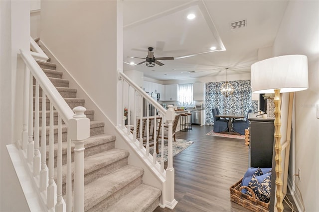 4316 Sailplane Ct, Wesley Chapel, FL 33545 - stairs featuring a ceiling fan, wood finished floors, recessed lighting, and a chandelier