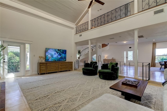 1089 Virginia St, Dunedin, FL 34698 - living room with high vaulted ceiling, ceiling fan, tile patterned flooring, and stairs