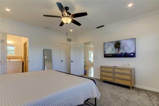 1089 Virginia St, Dunedin, FL 34698 - bedroom featuring ornamental molding, ensuite bath, baseboards, light carpet, and a sink