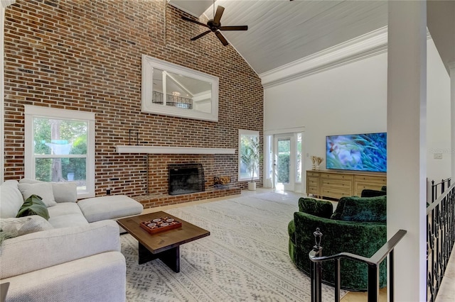1089 Virginia St, Dunedin, FL 34698 - living room featuring high vaulted ceiling, healthy amount of natural light, a ceiling fan, a brick fireplace, and brick wall