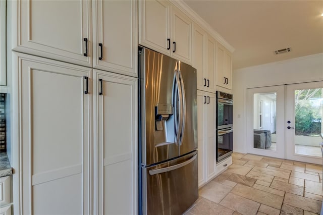 1089 Virginia St, Dunedin, FL 34698 - kitchen with stainless steel appliances, french doors, stone tile flooring, crown molding, and light stone counters