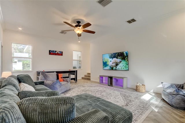 1089 Virginia St, Dunedin, FL 34698 - living area with ceiling fan, baseboards, and stairs