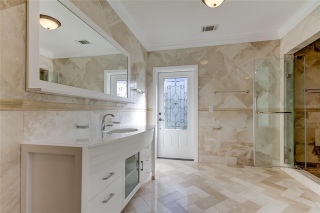 1089 Virginia St, Dunedin, FL 34698 - bathroom with crown molding, tile walls, a shower stall, and vanity