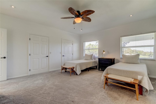 1089 Virginia St, Dunedin, FL 34698 - bedroom featuring light colored carpet, ceiling fan, and baseboards