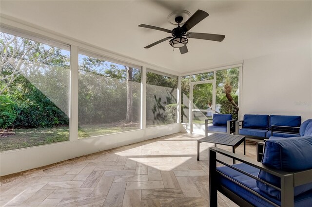 1089 Virginia St, Dunedin, FL 34698 - sunroom with outdoor lounge area, ceiling fan, and healthy amount of natural light