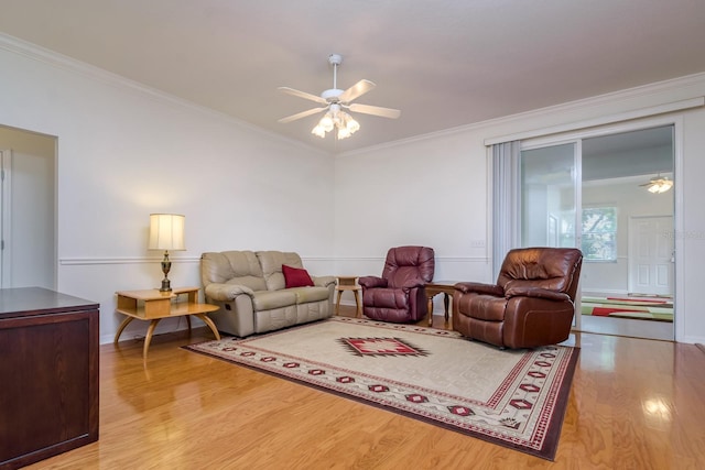 2214 Deerbrook Dr, Lakeland, FL 33811 - living room featuring ceiling fan, wood finished floors, crown molding, and baseboards