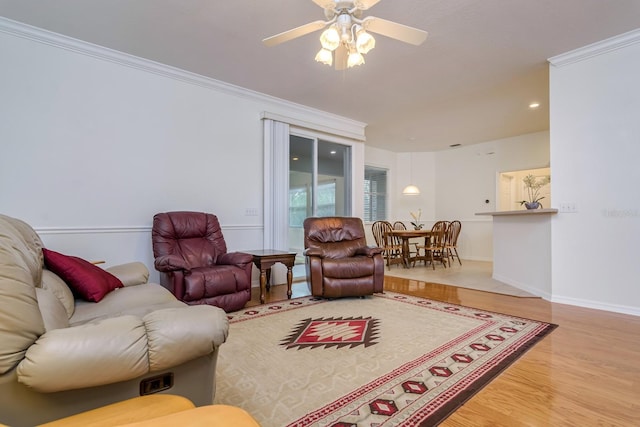 2214 Deerbrook Dr, Lakeland, FL 33811 - living room featuring wood finished floors, ceiling fan, ornamental molding, baseboards, and recessed lighting