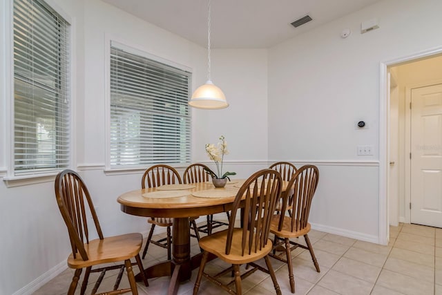 2214 Deerbrook Dr, Lakeland, FL 33811 - dining area with light tile patterned flooring and baseboards